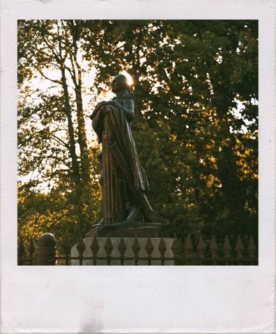 Statue In The Trees